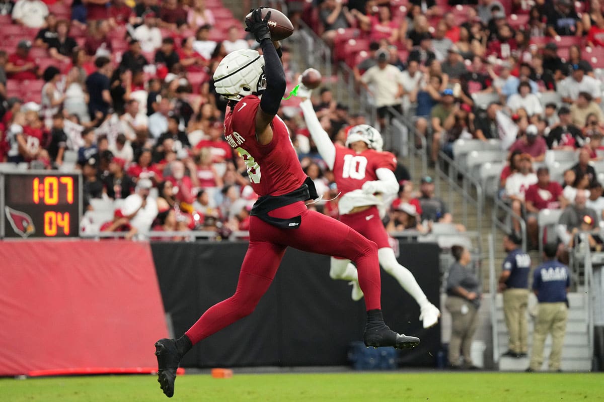 Arizona Cardinals receiver Marvin Harrison Jr. (18) catches a pass in the end. zone during training camp at State Farm Stadium in Glendale, Ariz., on Saturday, Aug. 3, 2024.