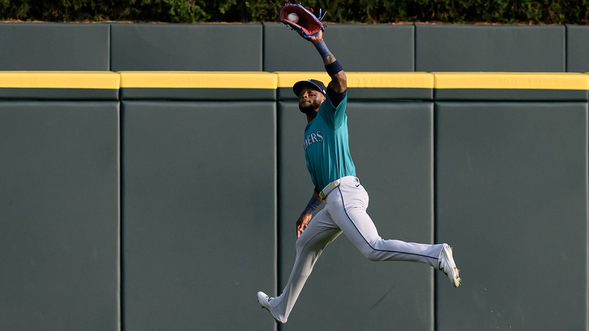 Aug 14, 2024; Detroit, Michigan, USA; Seattle Mariners center fielder Victor Robles (10) runs down a fly ball in deep center field against the Detroit Tigers in the first inning at Comerica Park. 