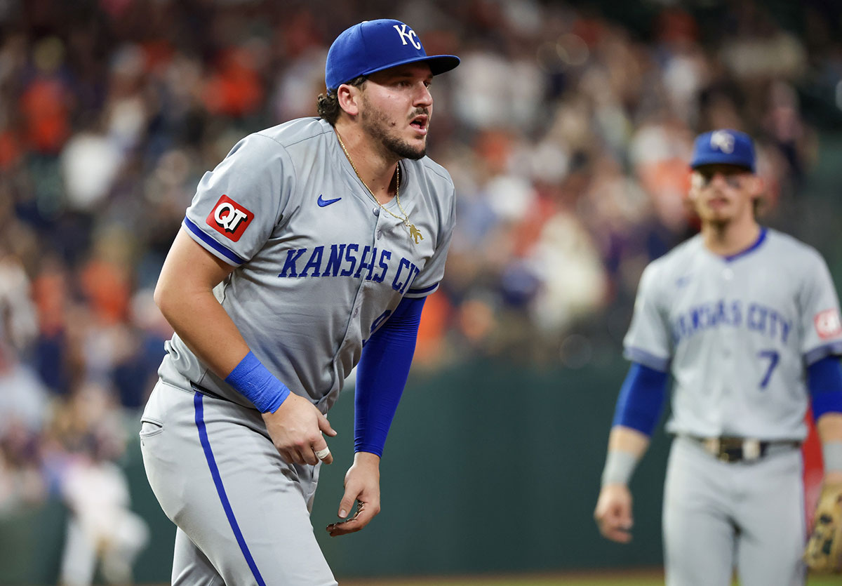 Kansas City Royals first baseman Vinnie Pasquantino (9) reacts after a collision with Houston Astros catcher Yainer Diaz (21)(not pictured) in the eighth inning at Minute Maid Park.