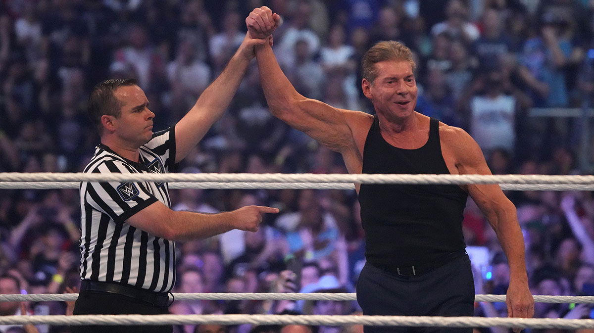 WWE owner Vince McMahon celebrates during WrestleMania at AT&T Stadium