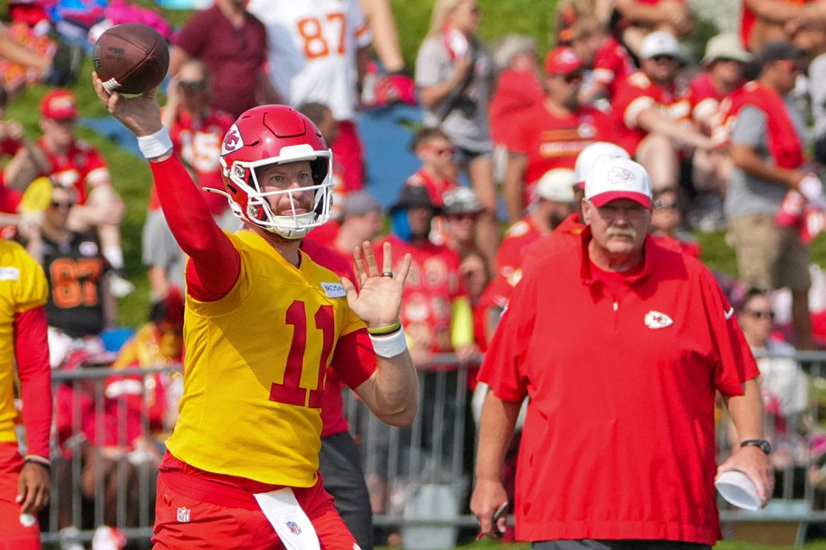 Kansas City Chiefs Kansas City Chiefs quarterback Carson Wentz (11) throws a pass as head coach Andy Reid looks on during training camp at Missouri Western State University.