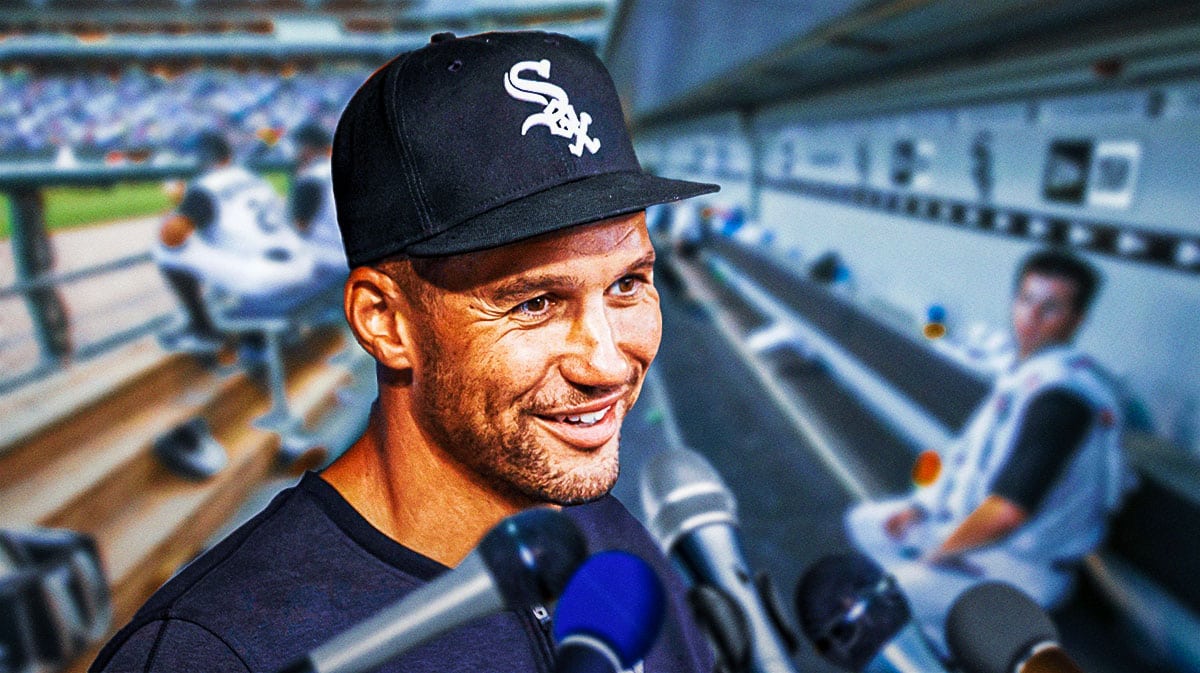 Grady Sizemore smiling while speaking to reporters with microphones in his face inside the White Sox dugout