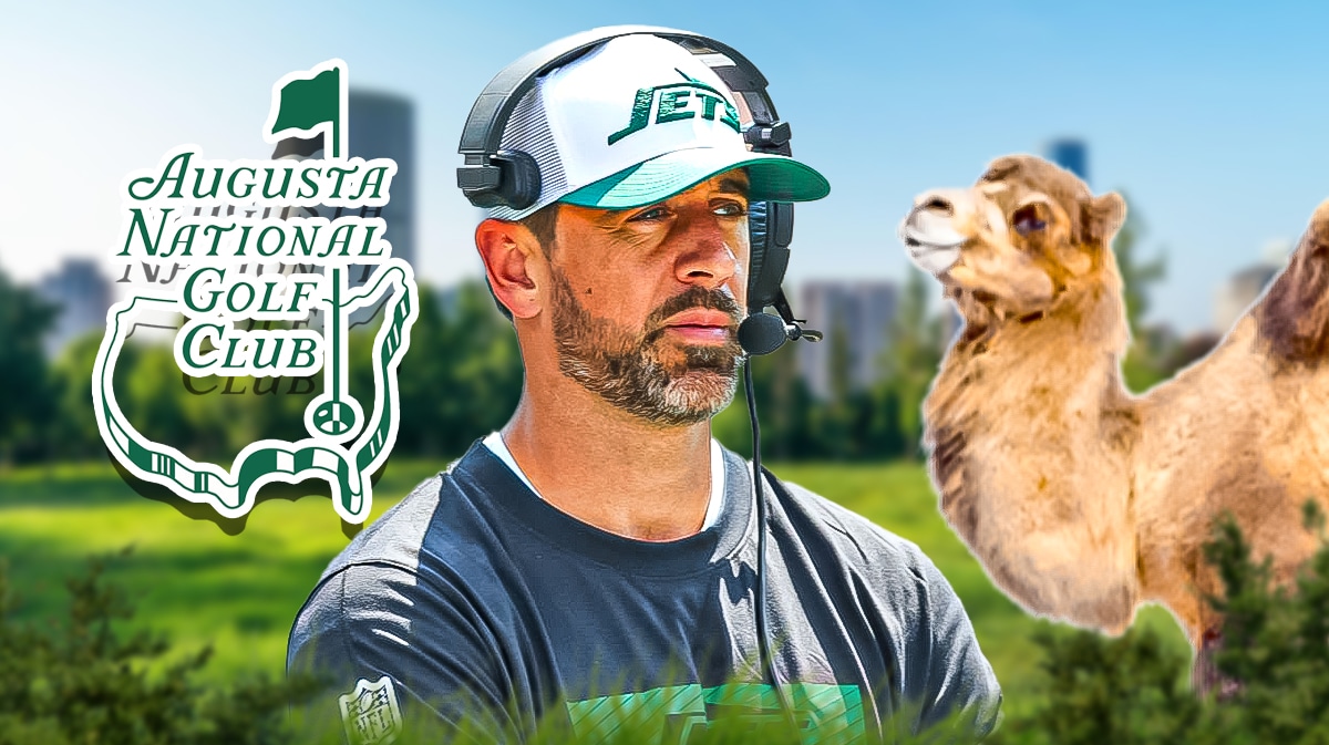 Aaron Rodgers in jets gear. Augusta National logo behind him to left. Camel behind him to right