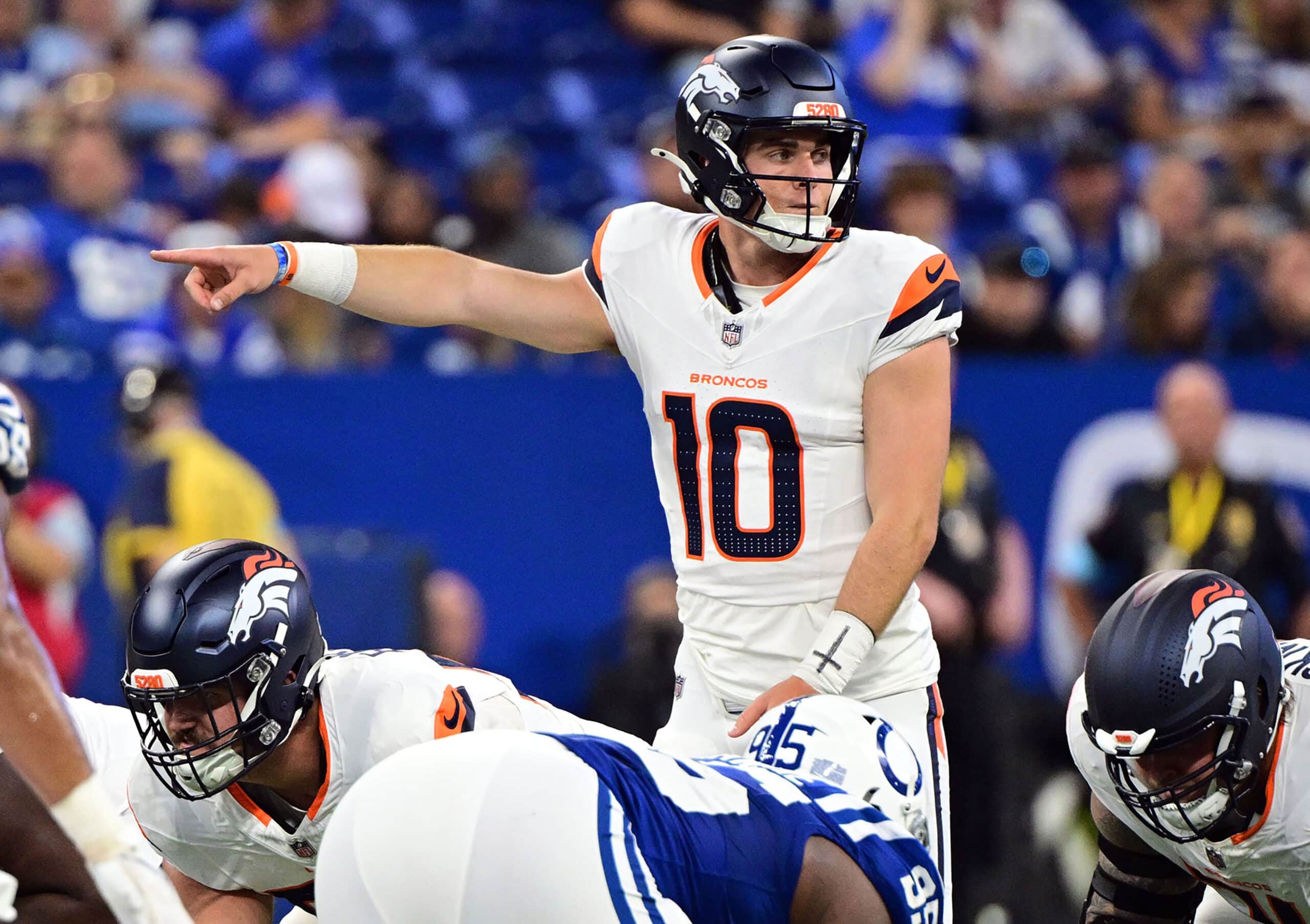 Denver Broncos quarterback Bo Nix (10) points during the second quarter against the Indianapolis Colts at Lucas Oil Stadium.