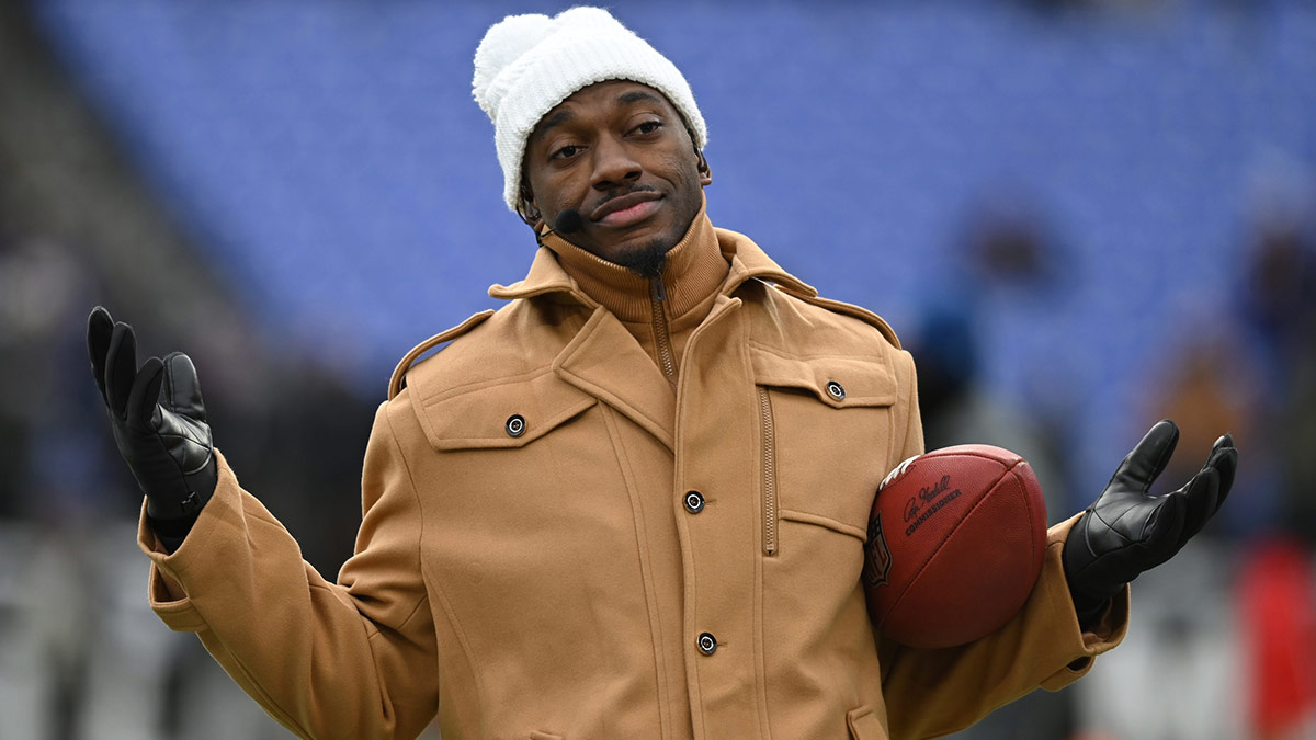 ESPN college football and NFL analyst Robert Griffin III reacts on the sidelines before a 2024 AFC divisional round game between the Houston Texans and the Baltimore Ravens at M&T Bank Stadium. 