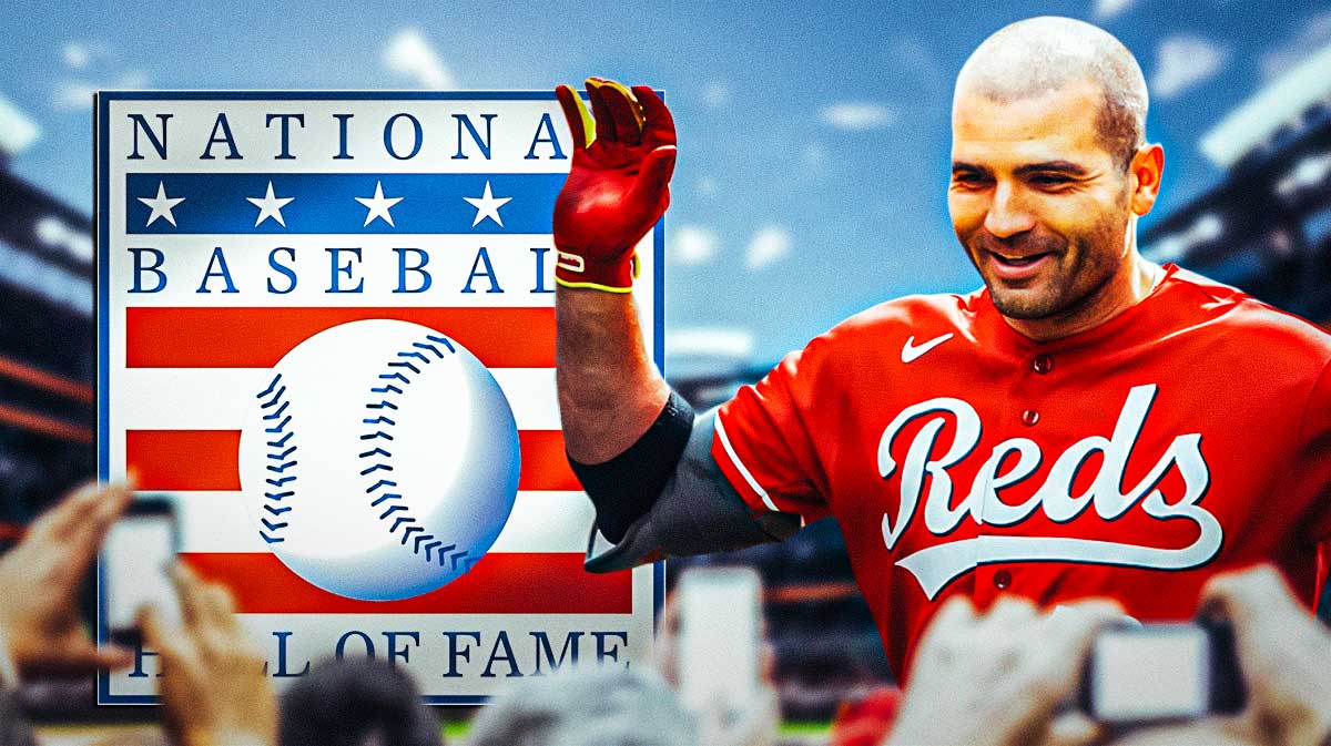 Former Cincinnati Reds star Joey Votto next to the baseball Hall of Fame logo in front of Great American Ballpark.