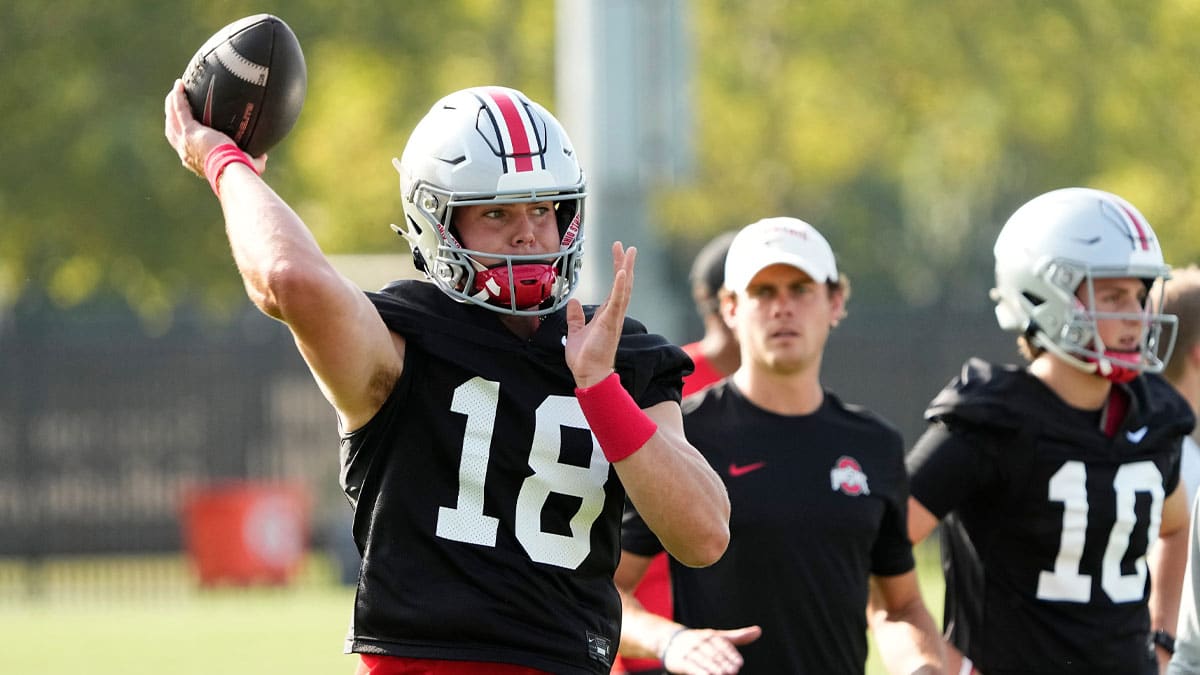 Ohio State Buckeyes quarterback Will Howard (18) throws during football camp at the Woody Hayes Athletic Complex.