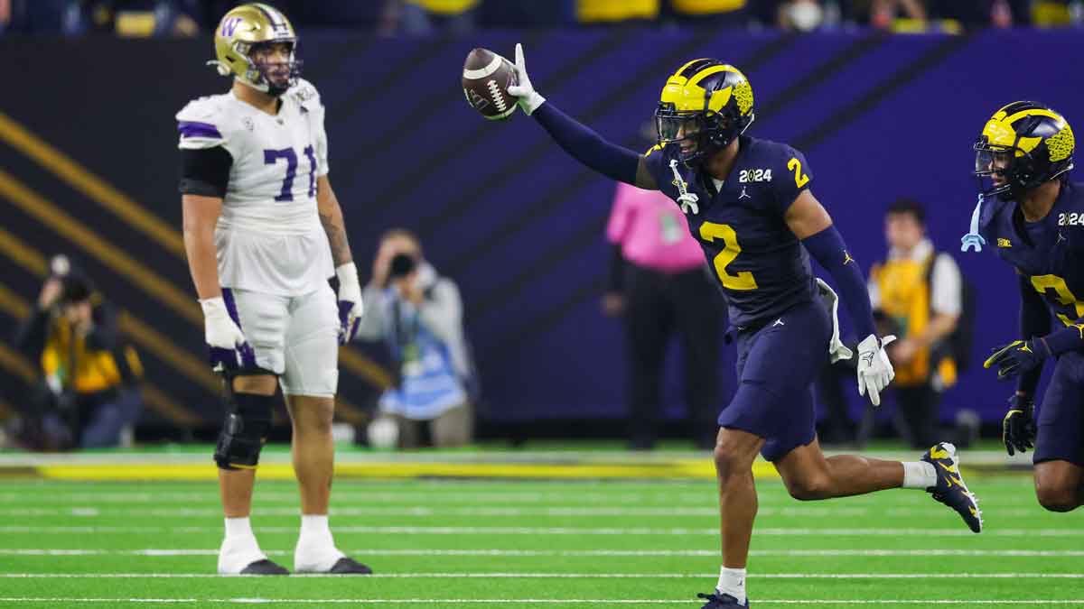 Michigan Wolverines defensive back Will Johnson (2) celebrates with defensive back Keon Sabb (3) after a turnover against the Washington Huskies during the third quarter in the 2024 College Football Playoff national championship game at NRG Stadium.