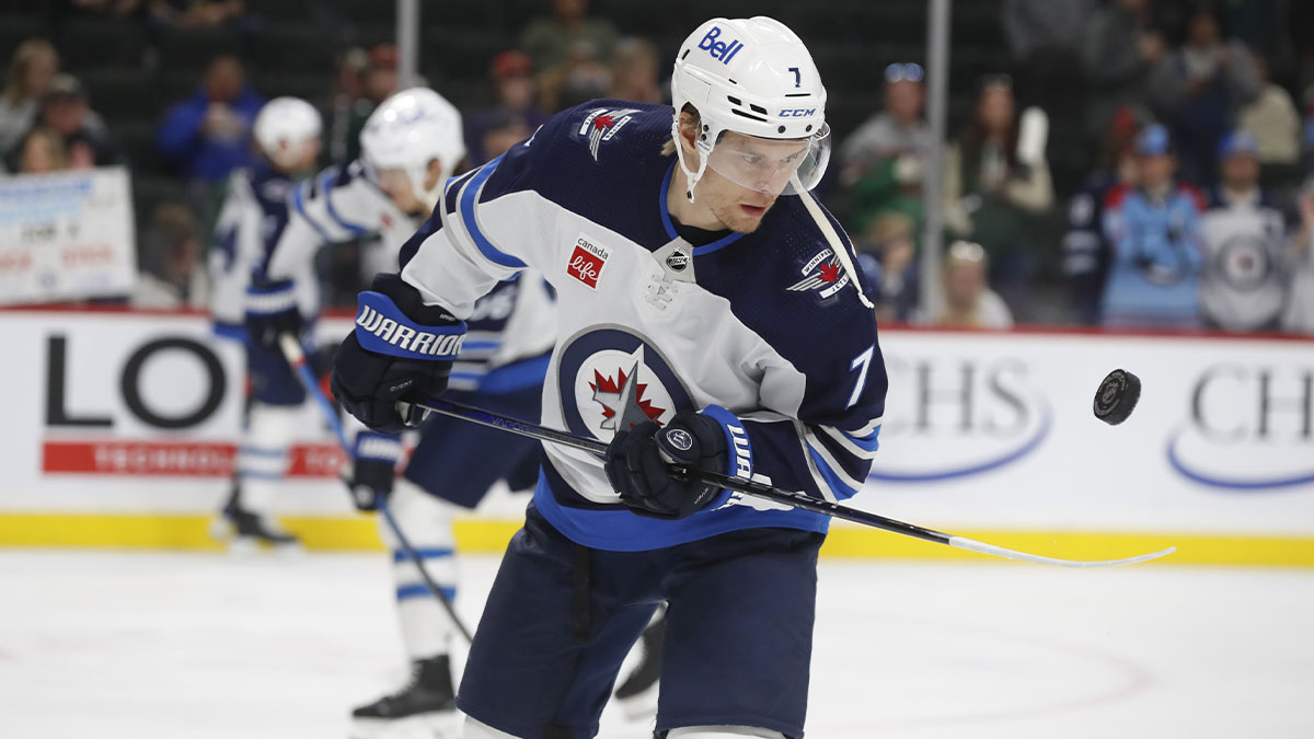 Winnipeg Jets center Vladislav Namestnikov (7) juggles the puck as he warms up before a game against the Minnesota Wild at Xcel Energy Center.