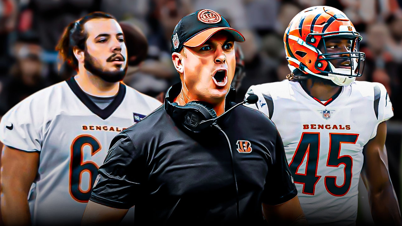 Coach Zac Taylor in the middle, Maema Njongmeta, Matt Lee around him, Cincinnati Bengals wallpaper in the background