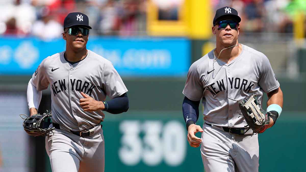 New York Yankees outfielder Aaron Judge (R) and outfielder Juan Soto (L) run from the outfield after the sixth inning against the Philadelphia Phillies at Citizens Bank Park.