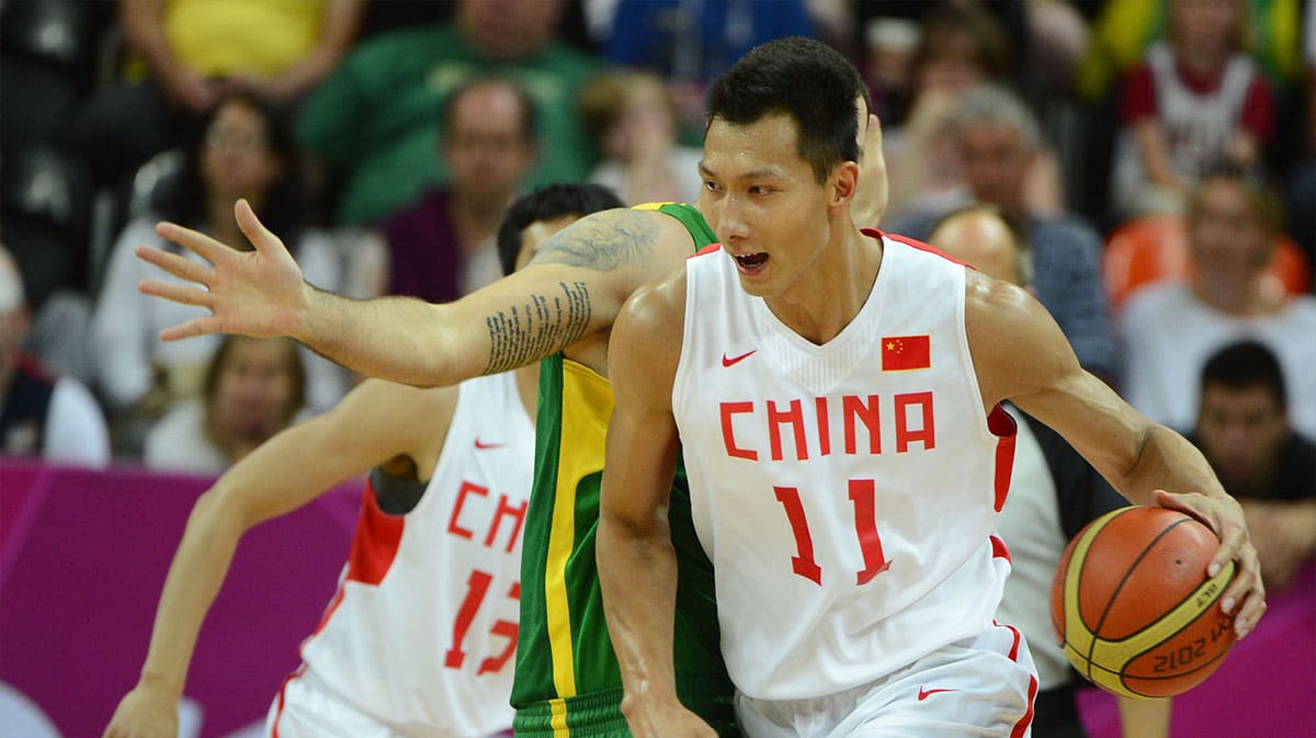 China forward Jianlian Yi (11) dribbles in the second half during the London 2012 Olympic Games at Basketball Arena. Brazil won 98-59.