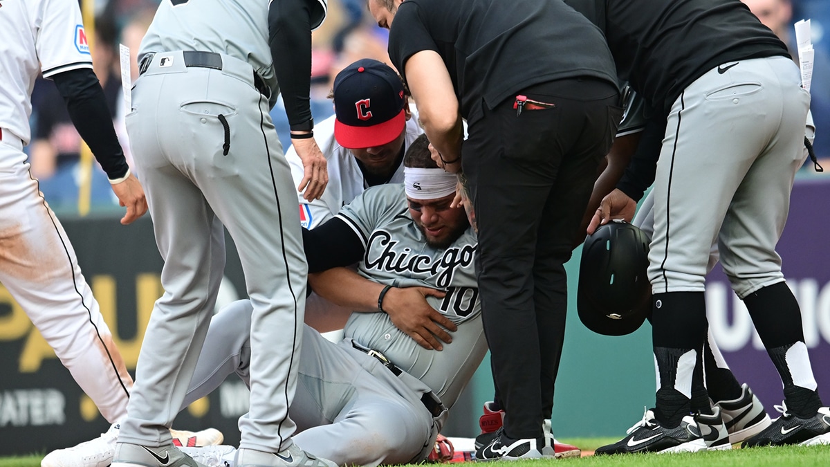 Apr 9, 2024; Cleveland, Ohio, USA; Chicago White Sox third baseman Yoan Moncada (10) is helped up after being injured during the second inning against the Cleveland Guardians at Progressive Field. 