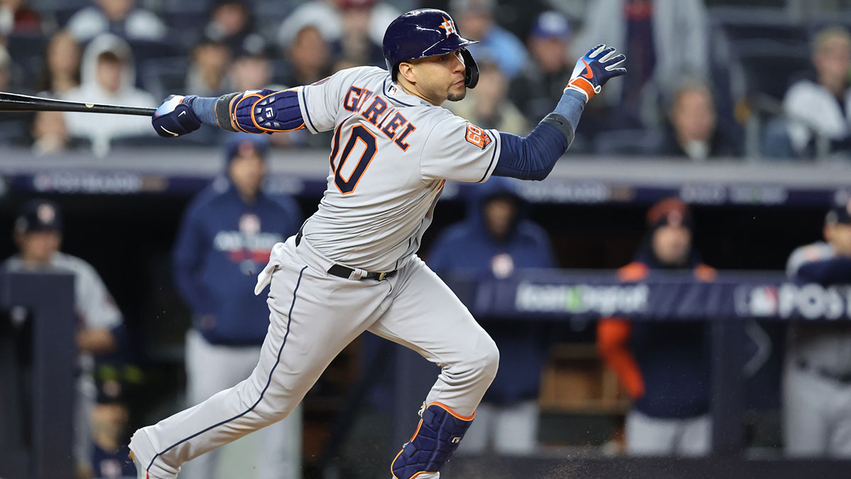 Oct 23, 2022; Bronx, New York, USA; Houston Astros first baseman Yuli Gurriel (10) hits an RBI single in the third inning against the New York Yankees during game four of the ALCS for the 2022 MLB Playoffs at Yankee Stadium.
