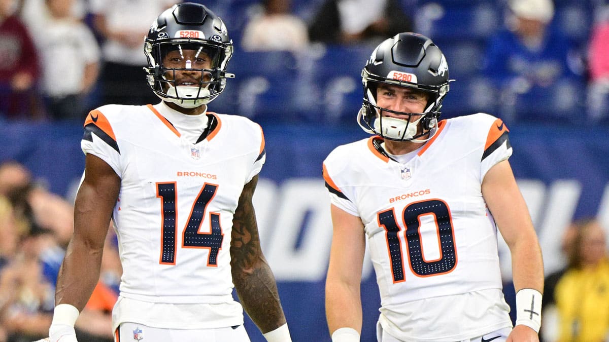 Denver Broncos wide receiver Courtland Sutton (14) and quarterback Bo Nix (10) stand on the field during warm ups before the game against the Indianapolis Colts at Lucas Oil Stadium.