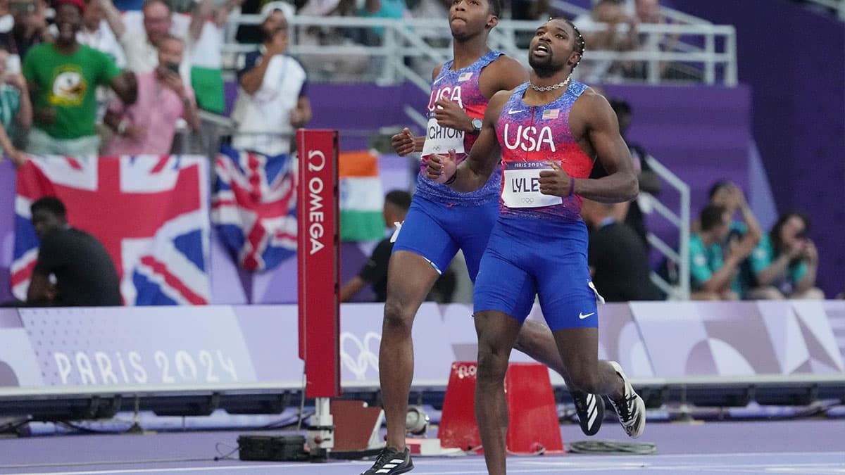 Noah Lyles (USA) and Erriyon Knighton (USA) reacts after the men's 200m final during the Paris 2024 Olympic Summer Games at Stade de France.