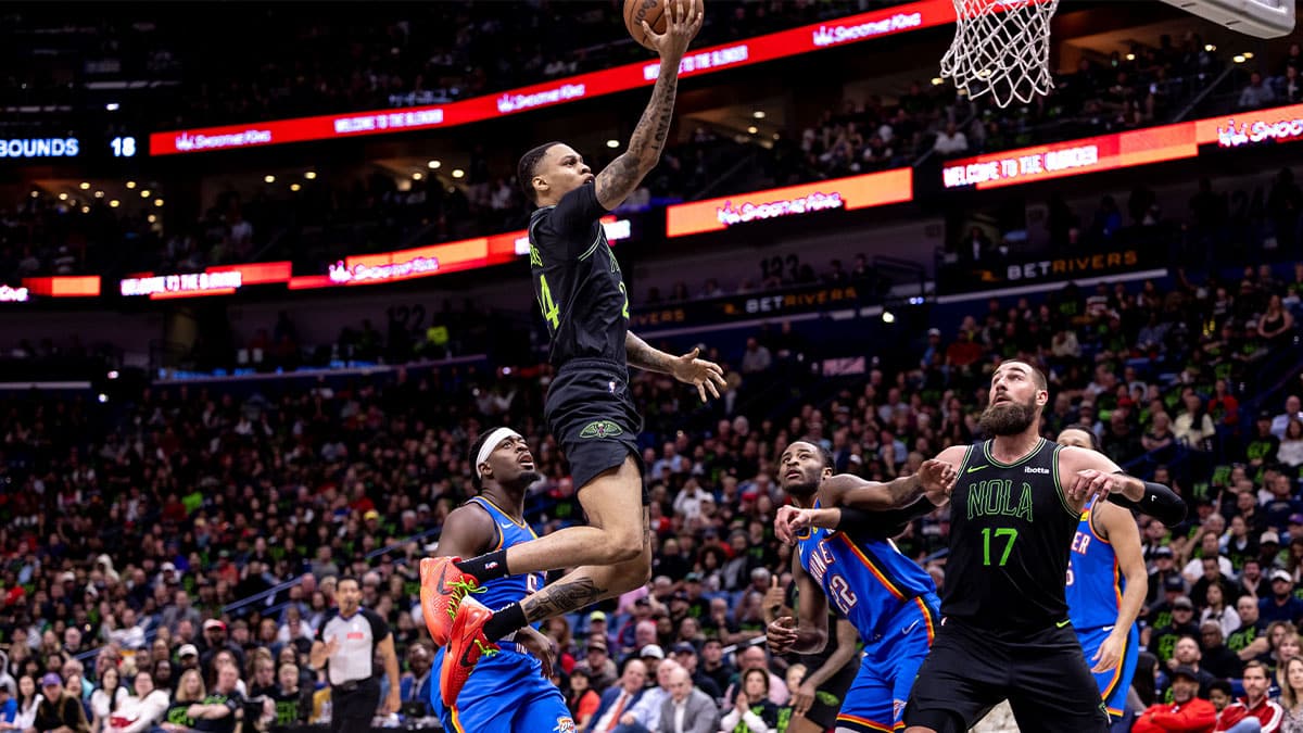 New Orleans Pelicans guard Jordan Hawkins (24) drives to the basket against Oklahoma City Thunder guard Luguentz Dort (5) during the first half of game four of the first round for the 2024 NBA playoffs at Smoothie King Center.