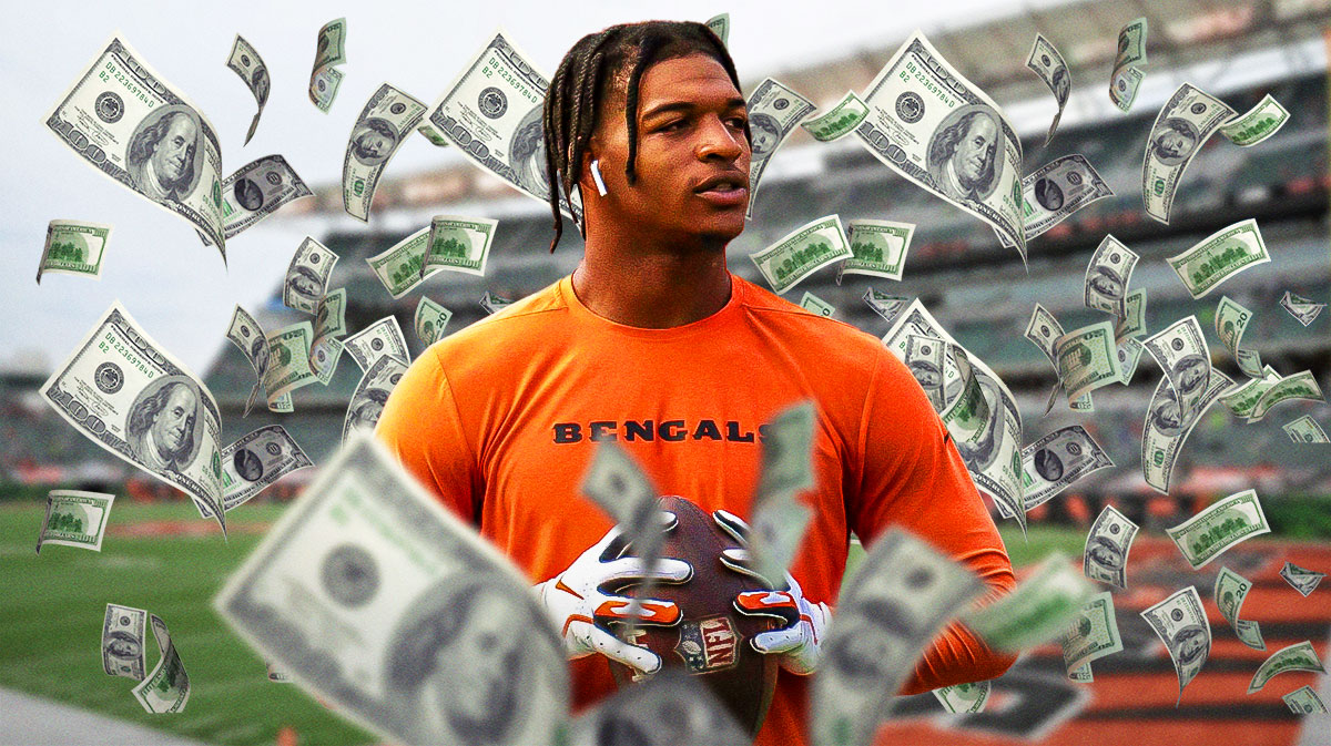 Cincinnati Bengals wide receiver Ja'Marr Chase with money around him