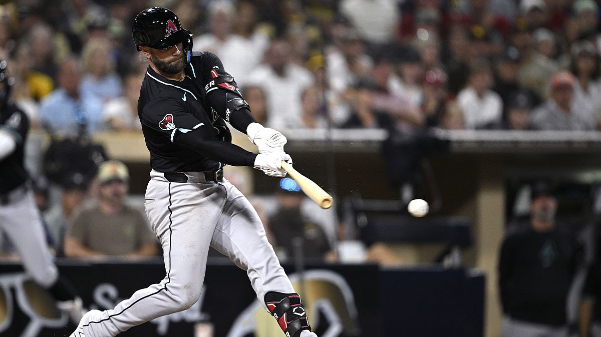 Arizona Diamondbacks first baseman Christian Walker (53) hits a two-RBI single against the San Diego Padres during the tenth inning at Petco Park.