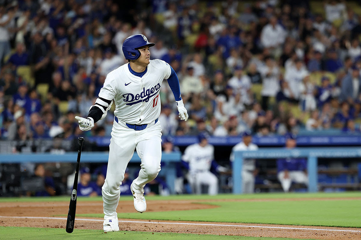 Los Angeles Dodgers designated hitter Shohei Ohtani (17) hits a home run during the first inning against the Chicago Cubs at Dodger Stadium.