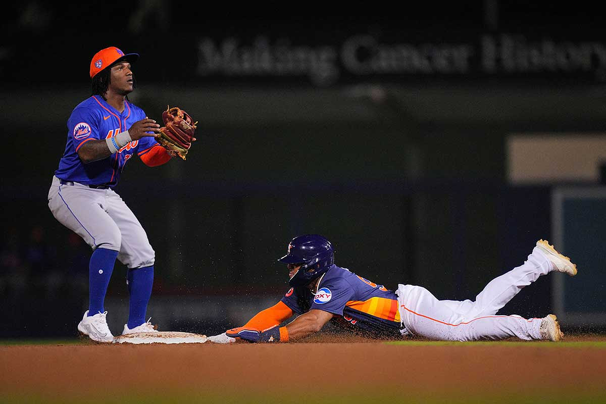 Houston Astros outfielder Pedro Leon steals second base as New York Mets second baseman Luisangel Acuna (73) waits for the ball in the seventh inning at The Ballpark of the Palm Beaches.