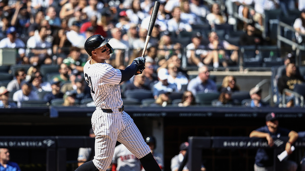 New York Yankees center fielder Aaron Judge (99) hits a two-run home run in the third inning against the Boston Red Sox at Yankee Stadium.