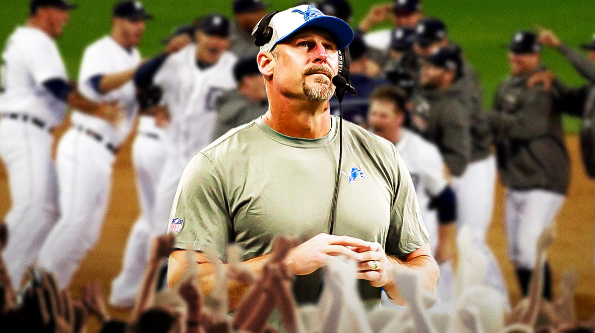Lions coach Dan Campbell looking at the Tigers celebrating.