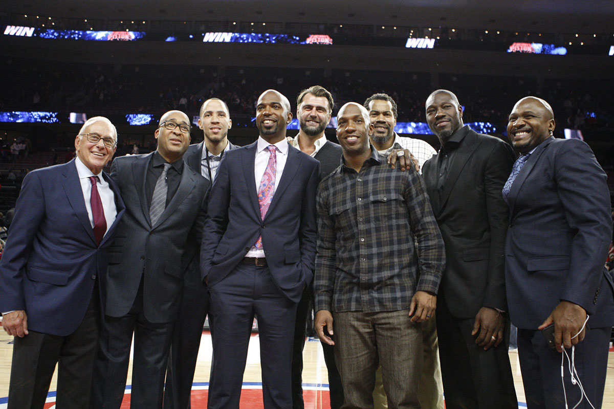 Larry Brown and William Wesley and Tayshaun Prince and Richard Hamilton and Mehmet Okur and Chauncy Billups and Rasheed Wallace and Ben Wallace and Lindsey Hunter pose for a photo after the game against the Golden State Warriors at The Palace of Auburn Hills. The Pistons won 113-95.
