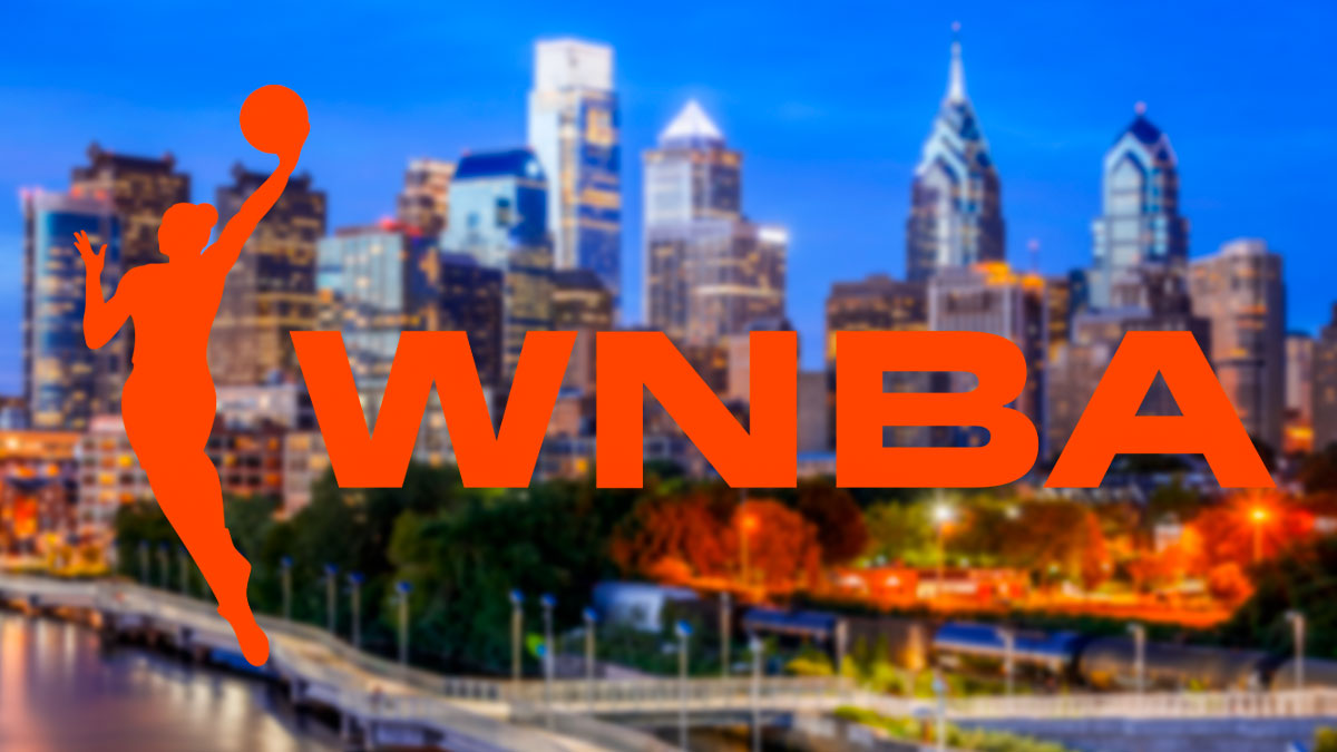 The WNBA logo in front of the Philadelphia skyline (76ers)