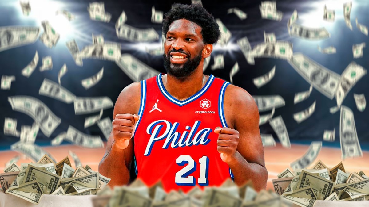 Joel Embiid with cash flying all around