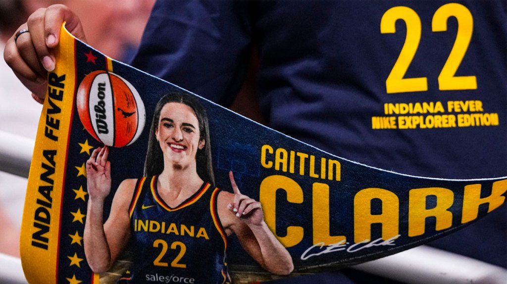 An Indiana Fever fan holds up a Indiana Fever guard Caitlin Clark (22) banner Friday, Sept. 6, 2024, during a game between the Indiana Fever and the Minnesota Lynx at Gainbride Fieldhouse in Indianapolis.