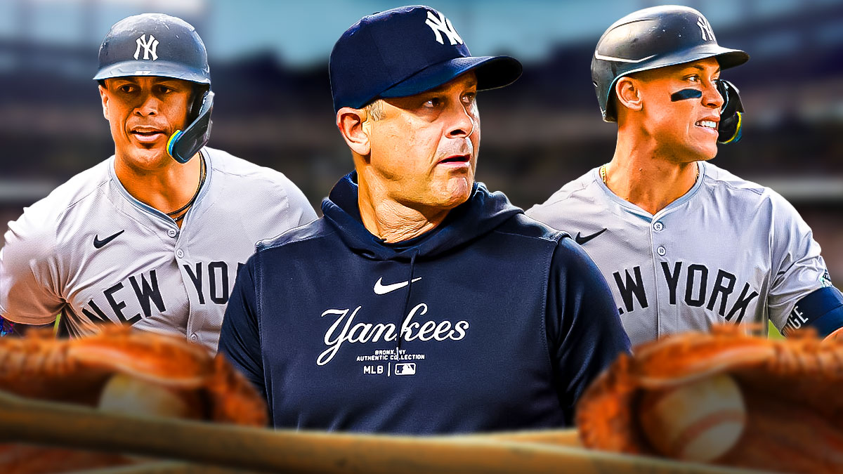 Aaron Boone, Aaron Judge, and Giancarlo Stanton with a Yankees Stadium background.