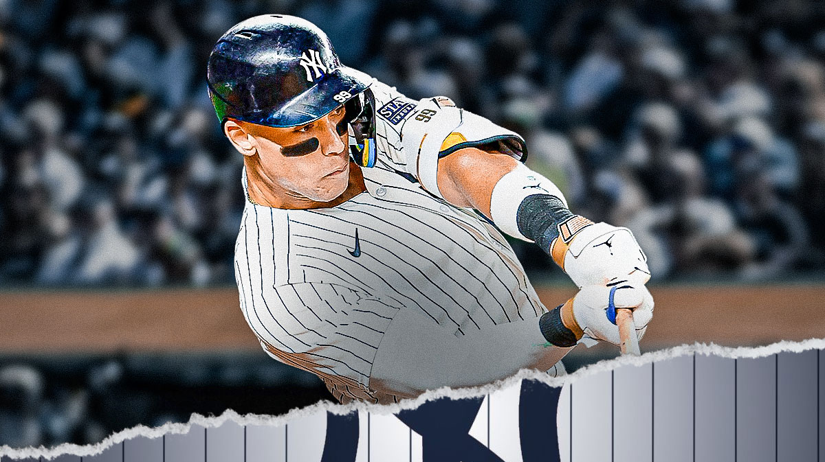 Aaron Judge hitting a baseball. Yankees logo in the background.