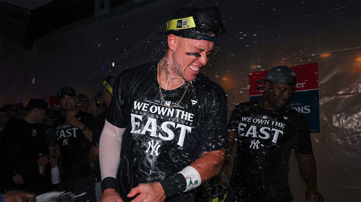 New York Yankees center fielder Aaron Judge (99) celebrates after defeating the Baltimore Orioles to clinch the American League East title at Yankee Stadium. 