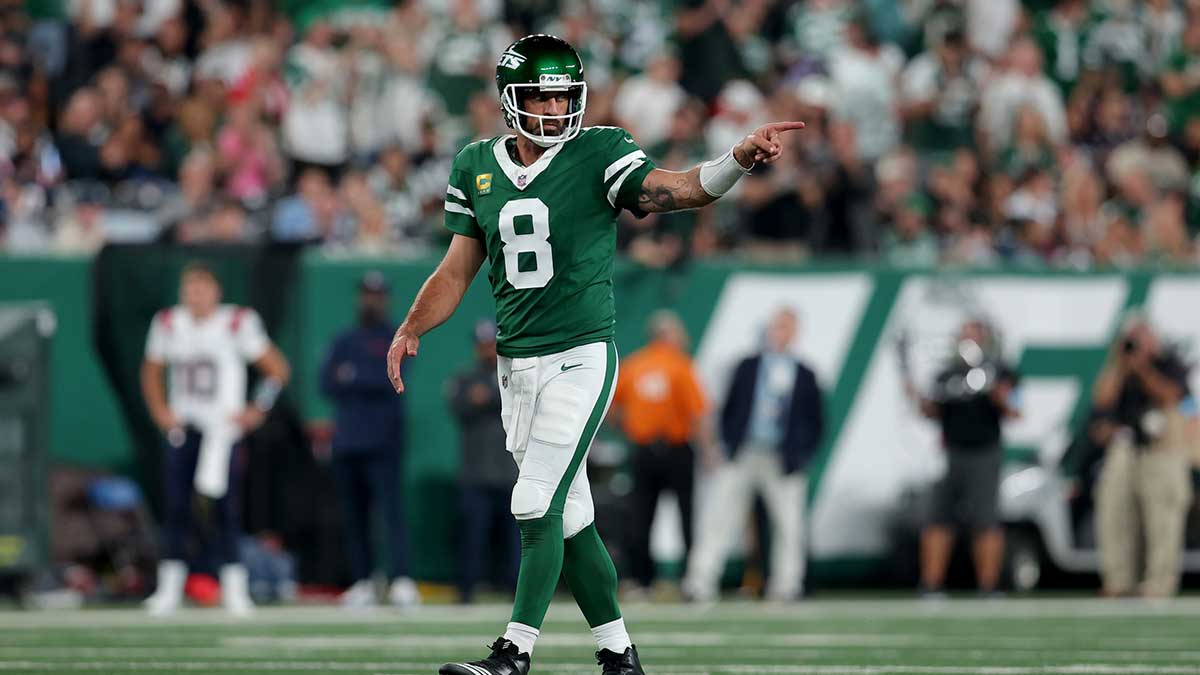 Sep 19, 2024; East Rutherford, New Jersey, USA; New York Jets quarterback Aaron Rodgers (8) reacts during the second quarter against the New England Patriots at MetLife Stadium. Mandatory Credit: Brad Penner-Imagn Images