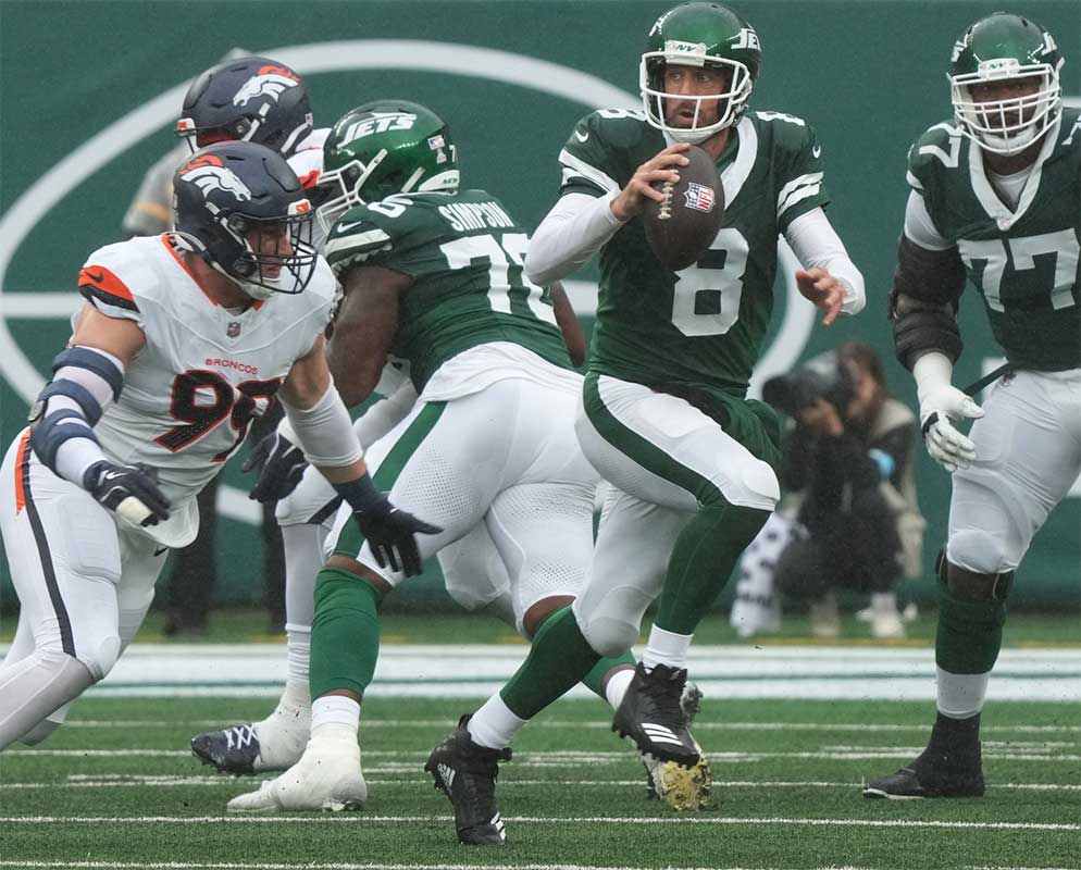East Rutherford, NJ -- September 29 -- Aaron Rodgers of the Jets runs the ball in the first half as the Denver Broncos edged the New York Jets 10-9 at MetLife Stadium.