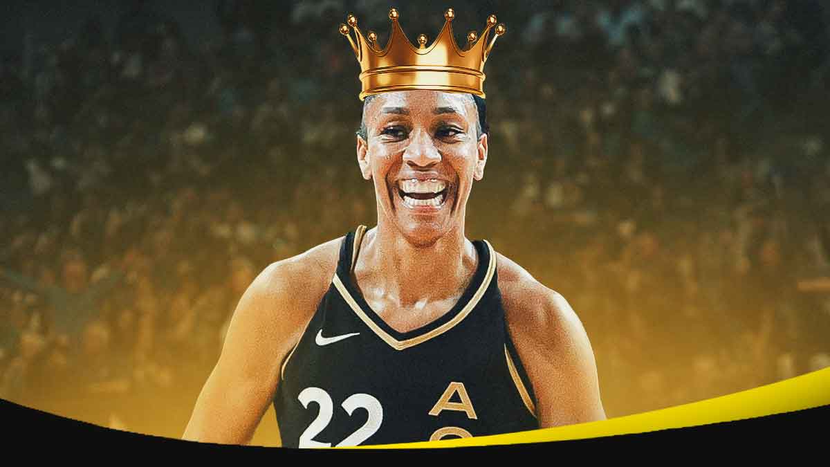 A'ja Wilson in Aces uniform with crown on her head