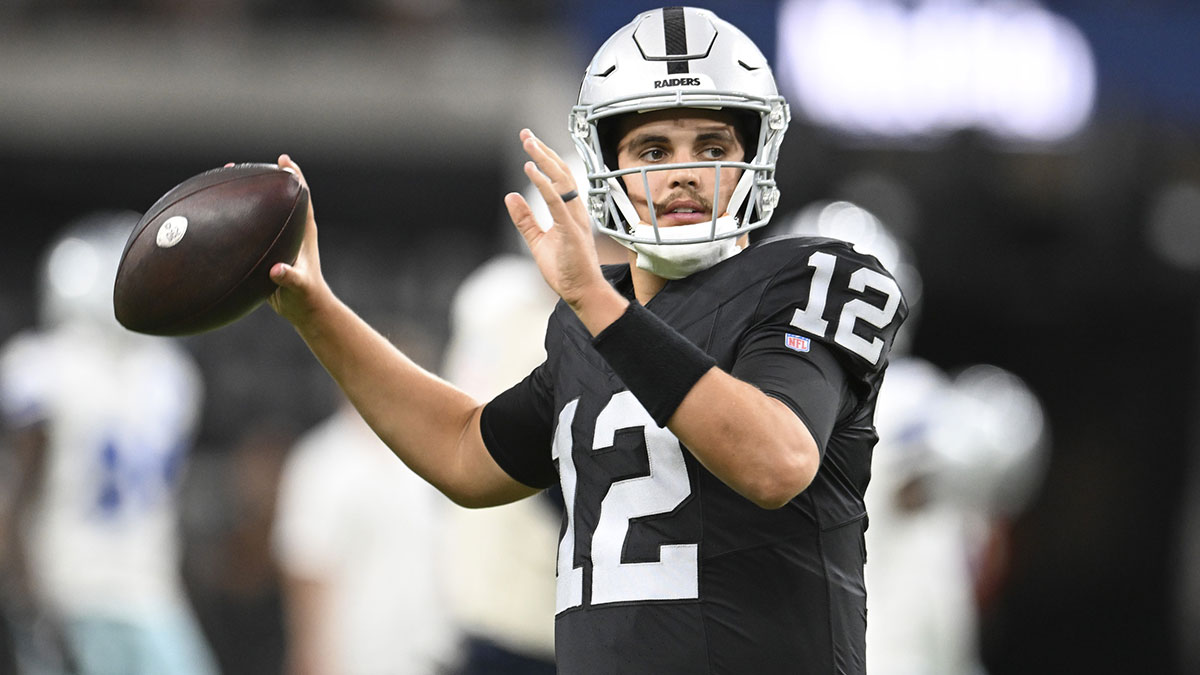 Las Vegas Raiders quarterback Aidan O'Connell (12) warms up against the Dallas Cowboys at Allegiant Stadium.