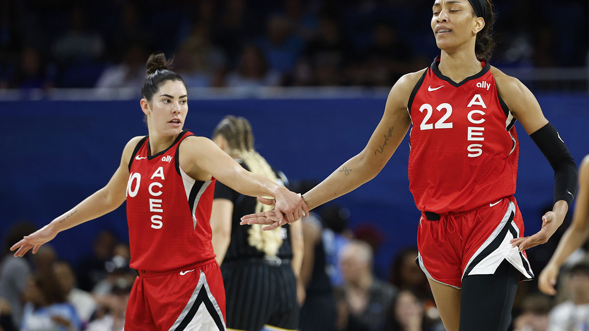 Aug 25, 2024; Chicago, Illinois, USA; Las Vegas Aces center A'ja Wilson (22) is congratulated by guard Kelsey Plum (10) after scoring against the Chicago Sky during the first half at Wintrust Arena.