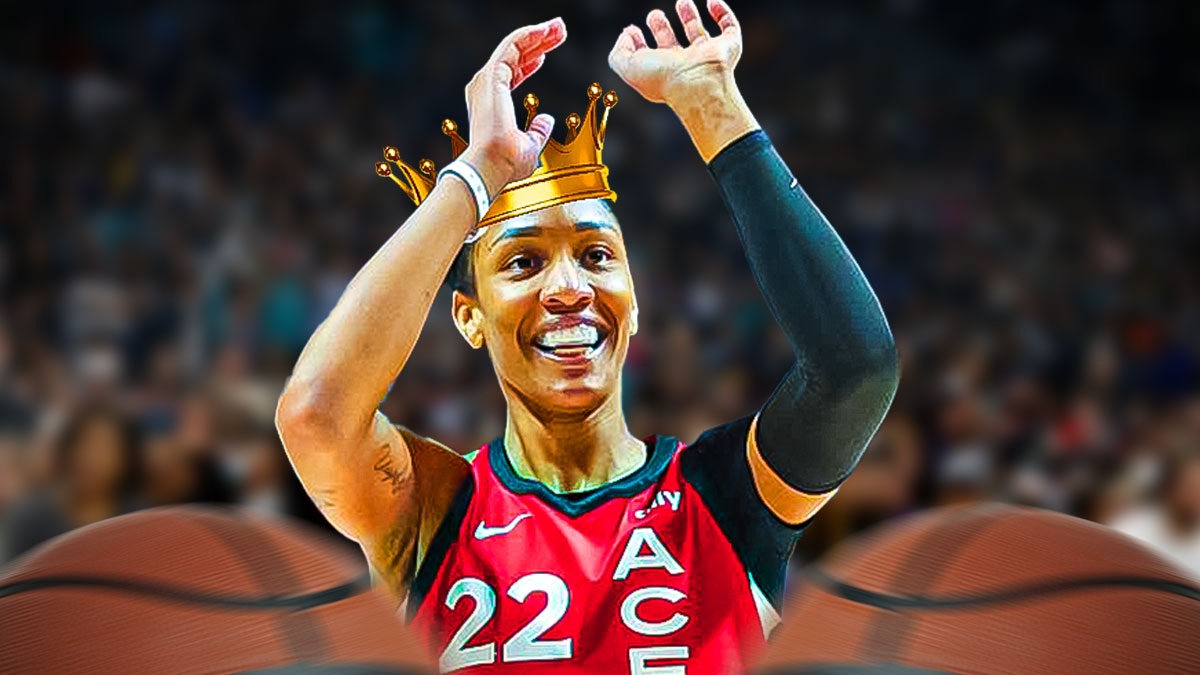 A'ja Wilson with a crown over her head, arms raised
