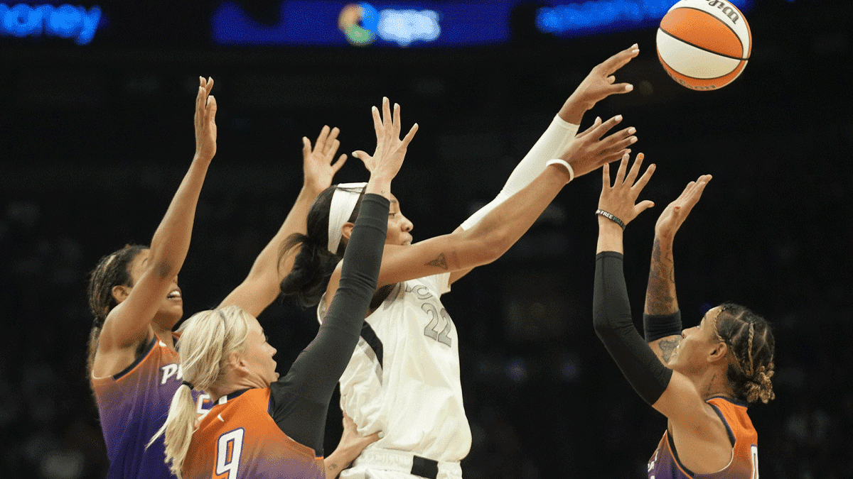 Las Vegas Aces center A'ja Wilson (22) is triple-teamed by thre Phoenix Mercury during the first quarter at Footprint Center on Sept. 1, 2024, in Phoenix.