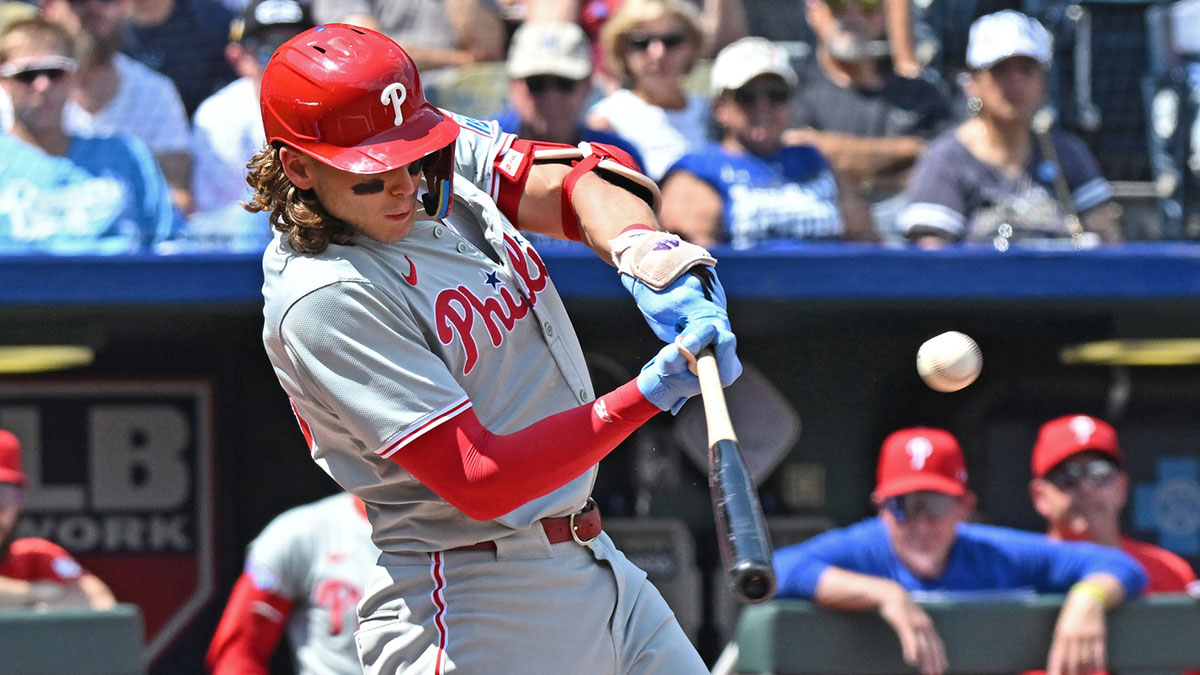 Philadelphia Phillies third baseman Alec Bohm (28) hits an RBI single in the third inning against the Kansas City Royals at Kauffman Stadium.