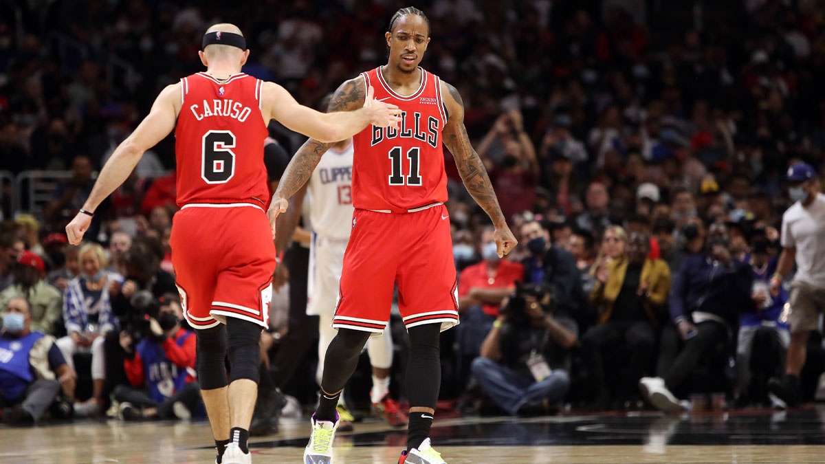 DeMar DeRozan (11) celebrates with guard Alex Caruso (6)