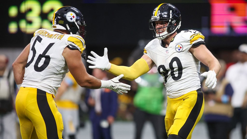 Pittsburgh Steelers linebacker T.J. Watt (90) celebrates with linebacker Alex Highsmith (56) after a sack against the Atlanta Falcons in the fourth quarter at Mercedes-Benz Stadium.