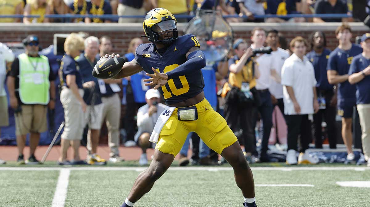 Michigan Wolverines quarterback Alex Orji (10) throws against the Arkansas State Red Wolves during the second half at Michigan Stadium.