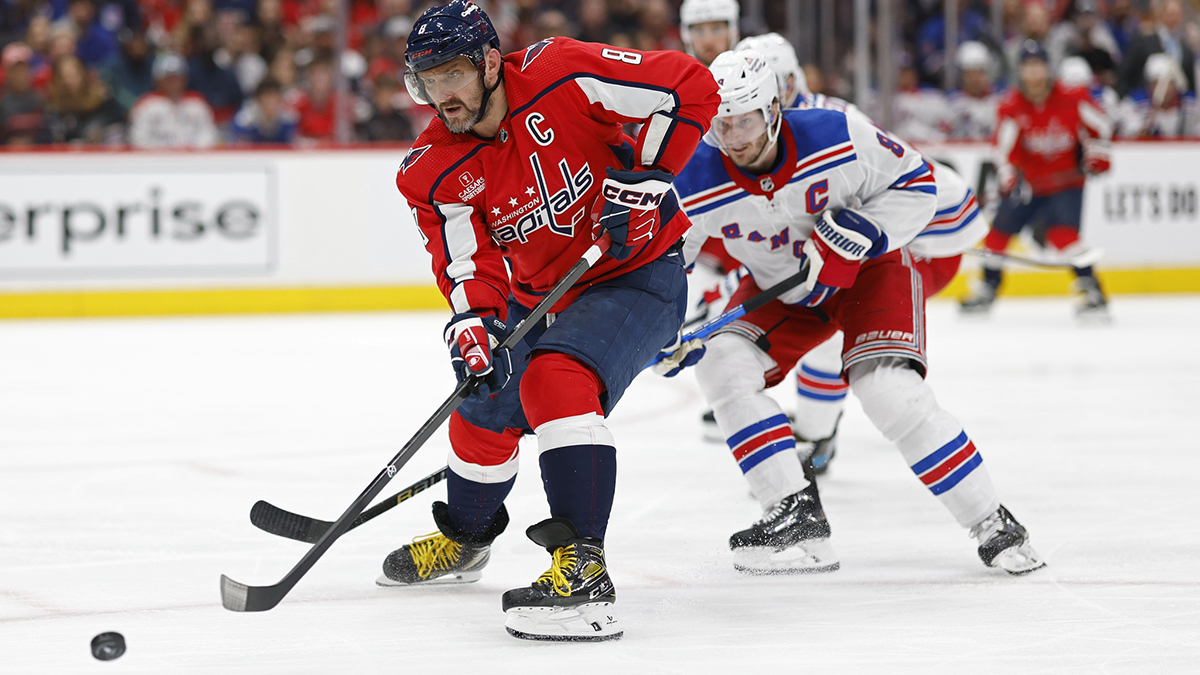 Washington Capitals left wing Alex Ovechkin (8) shoots the puck as New York Rangers defenseman Jacob Trouba (8) defends in the third period in game four of the first round of the 2024 Stanley Cup Playoffs at Capital One Arena.