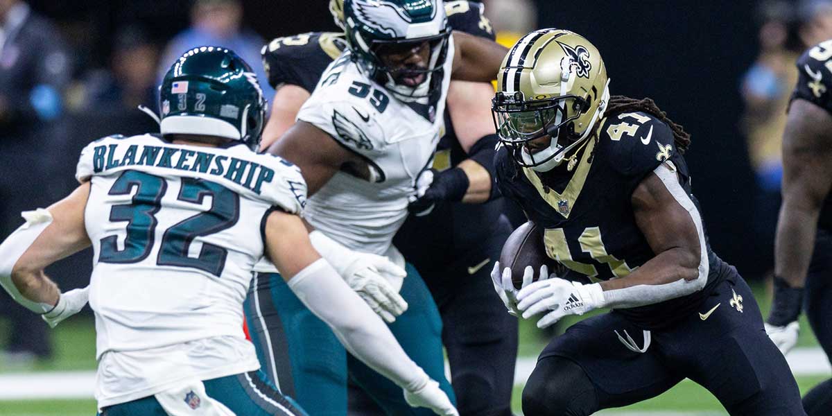 New Orleans Saints running back Alvin Kamara (41) runs against Philadelphia Eagles safety Reed Blankenship (32) during the first half at Caesars Superdome. 