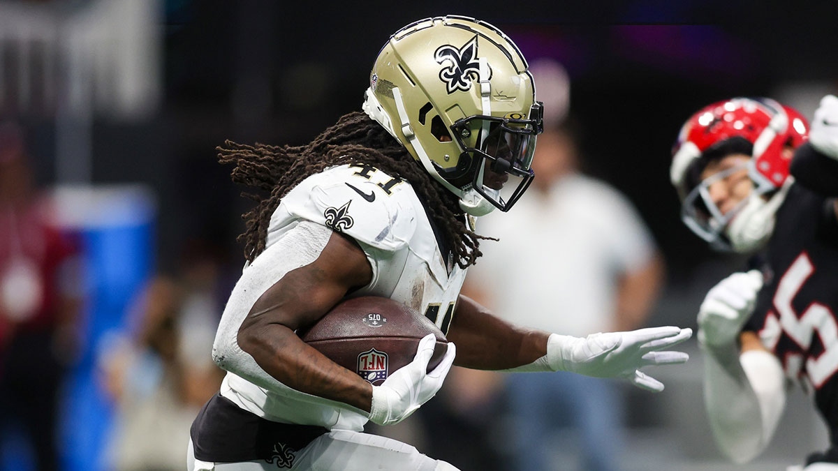 New Orleans Saints running back Alvin Kamara (41) runs the ball against the Atlanta Falcons in the second quarter at Mercedes-Benz Stadium.