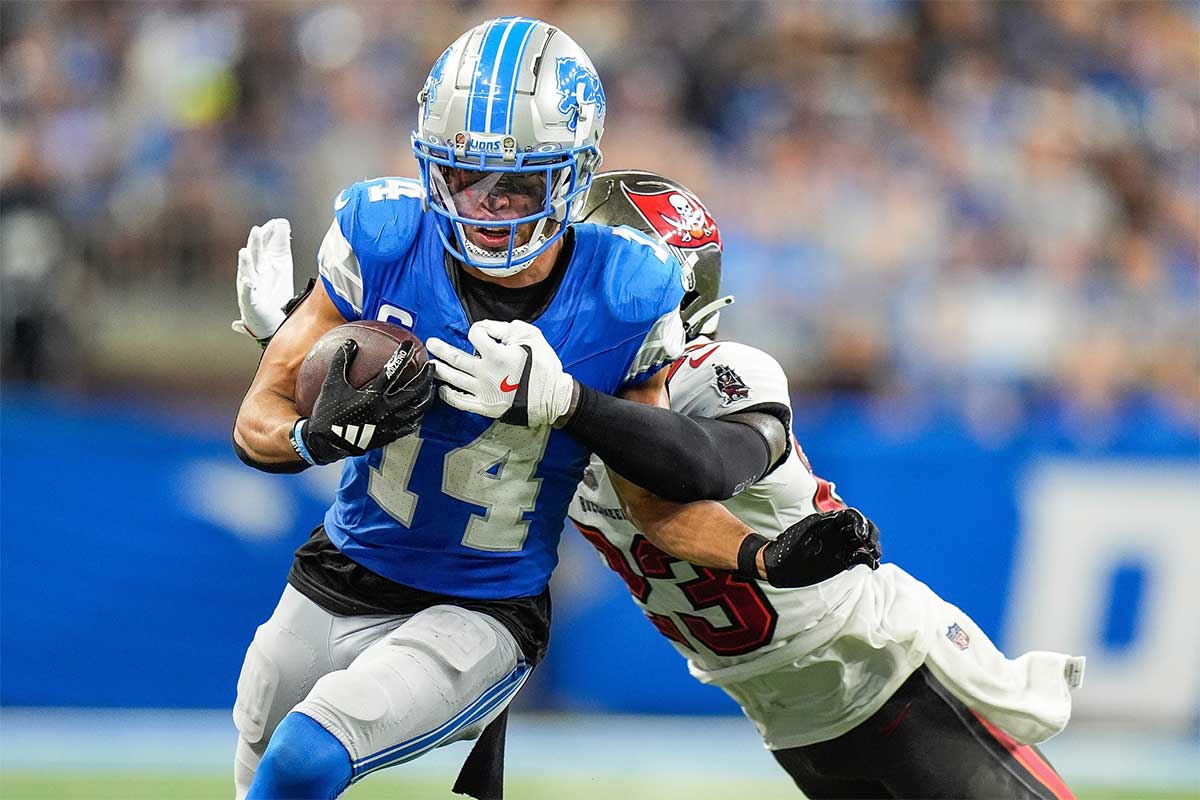 Detroit Lions wide receiver Amon-Ra St. Brown (14) makes a catch against Tampa Bay Buccaneers safety Tykee Smith (23) during the second half at Ford Field in Detroit on Sunday, September 15, 2024.