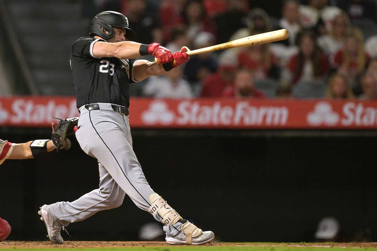 Chicago White Sox left fielder Andrew Benintendi (23) hits his second home run of the game, a solo shot, in the seventh inning against the Los Angeles Angels at Angel Stadium.